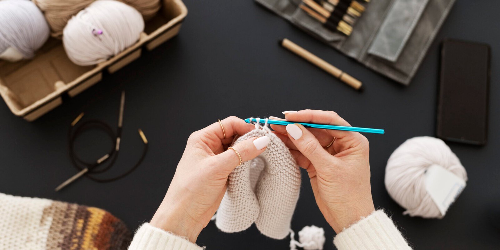 young-adult-organizing-their-knitting-products